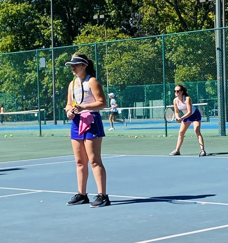 Emily and Aliyah playing doubles.